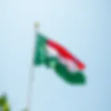 The Emirati Flag in All Its Glory Emirati flag fluttering against a clear blue sky