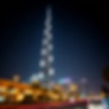 Night view of Dubai's tallest tower illuminated against the starry sky