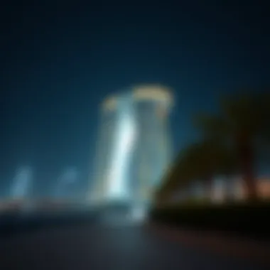 Night view of Capital Gate illuminated, symbolizing innovation
