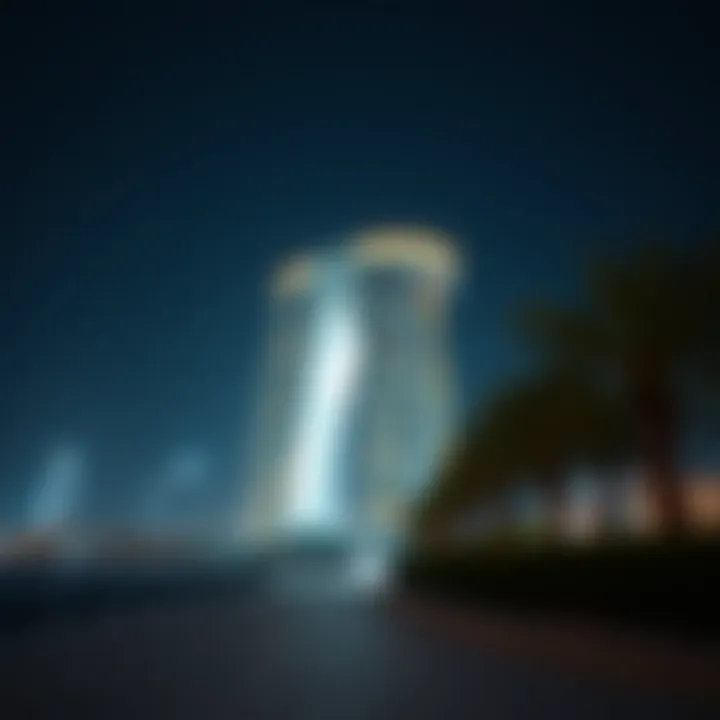 Night view of Capital Gate illuminated, symbolizing innovation