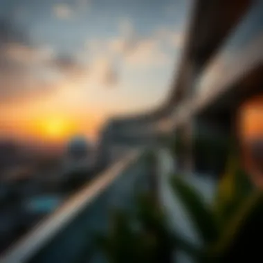 Modern balcony with glass railing and sunset